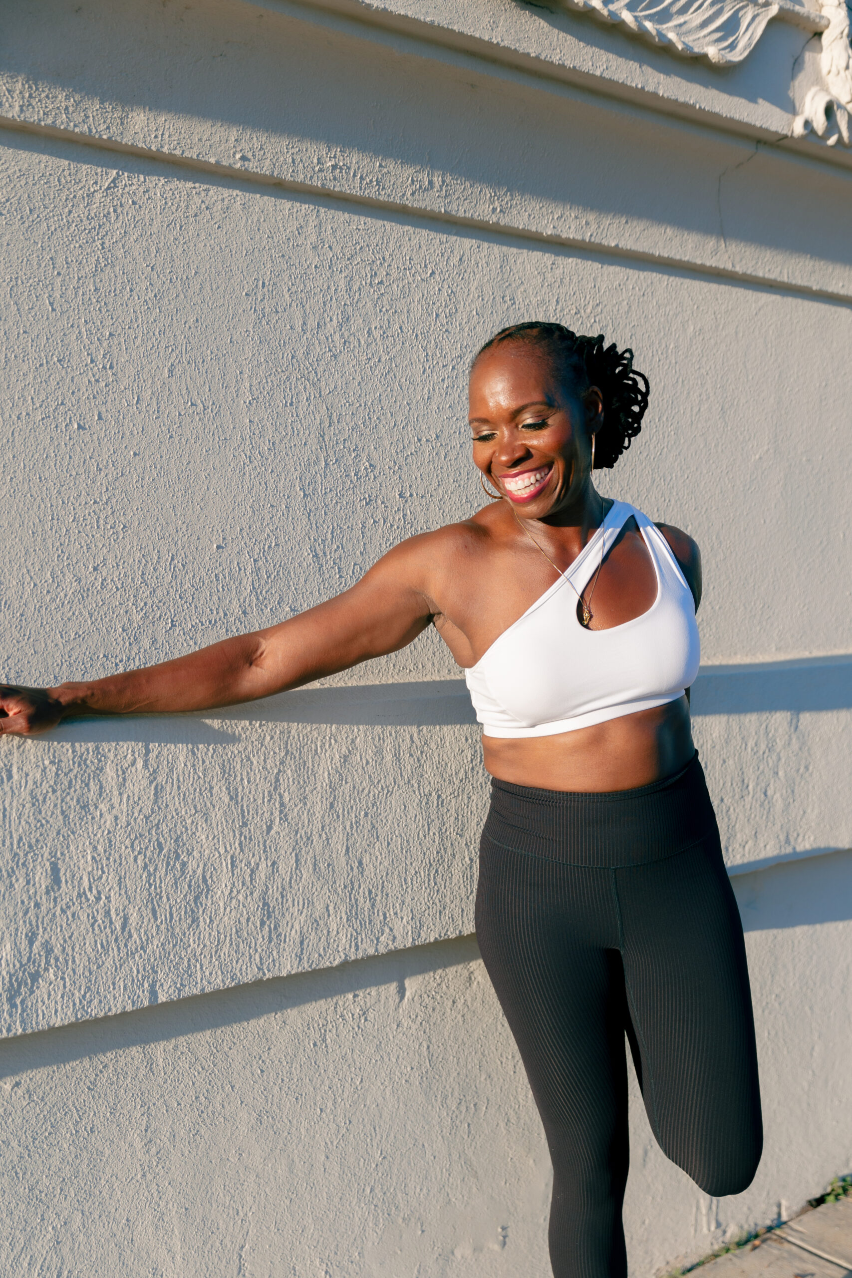 A very fit woman does a plank while looking fiercely ahead