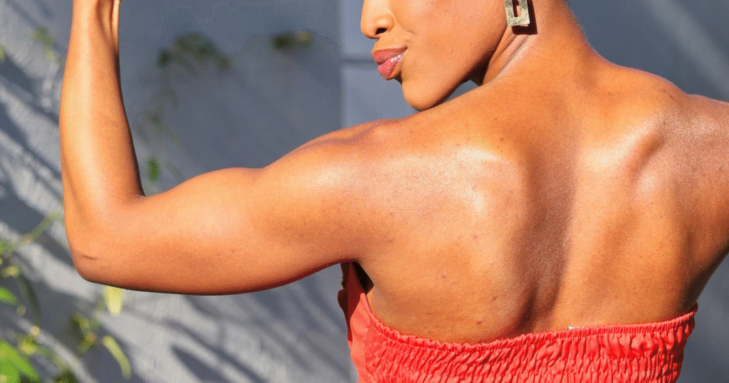 woman flexing biceps and toned body